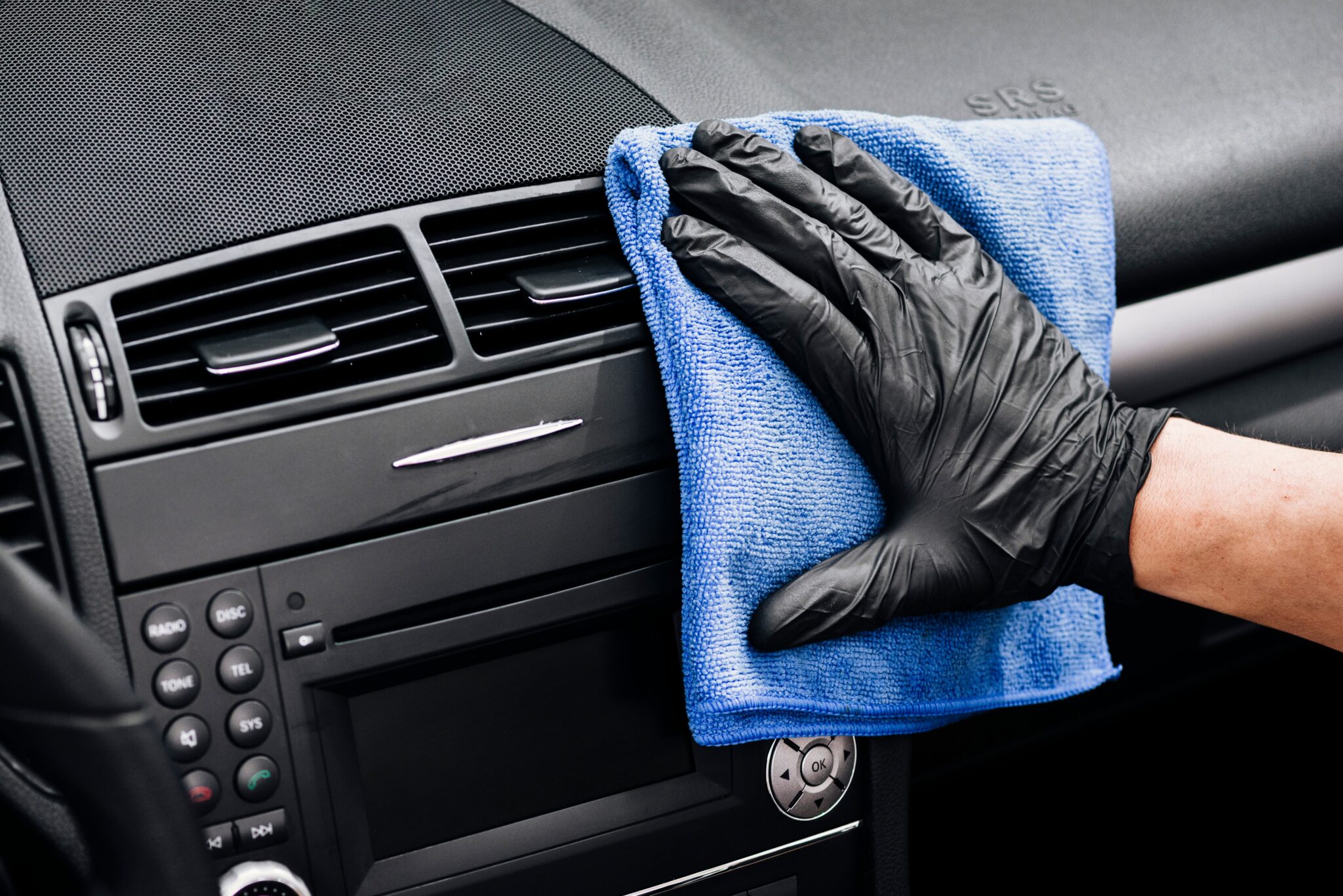 close-up-person-cleaning-car-interior (1)